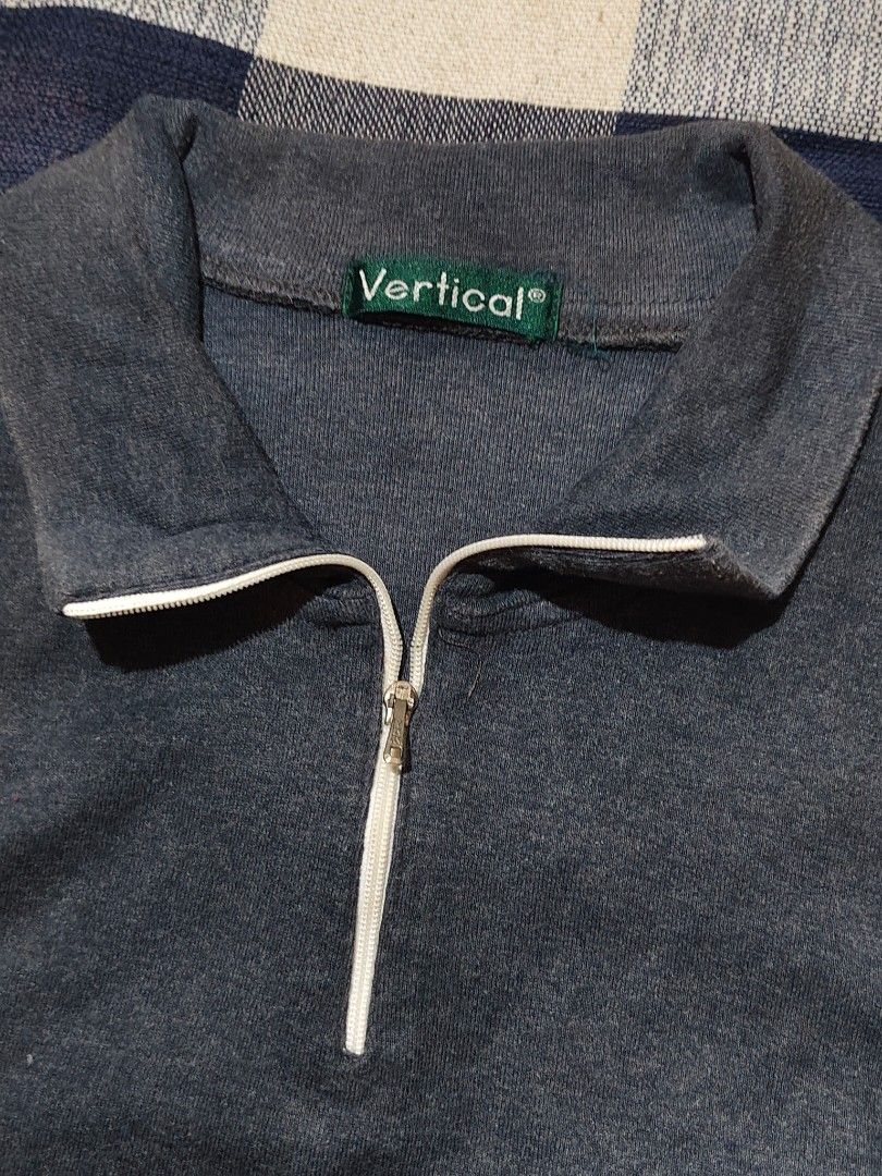 Vertical dark gray quarter-zip collar fitted polo top (Category: Sleeveless) located in Bulacan. Submitted by angel.decluttersx (Listing ID 1464691767, Image 2). Description: s-m cotton fabric material.