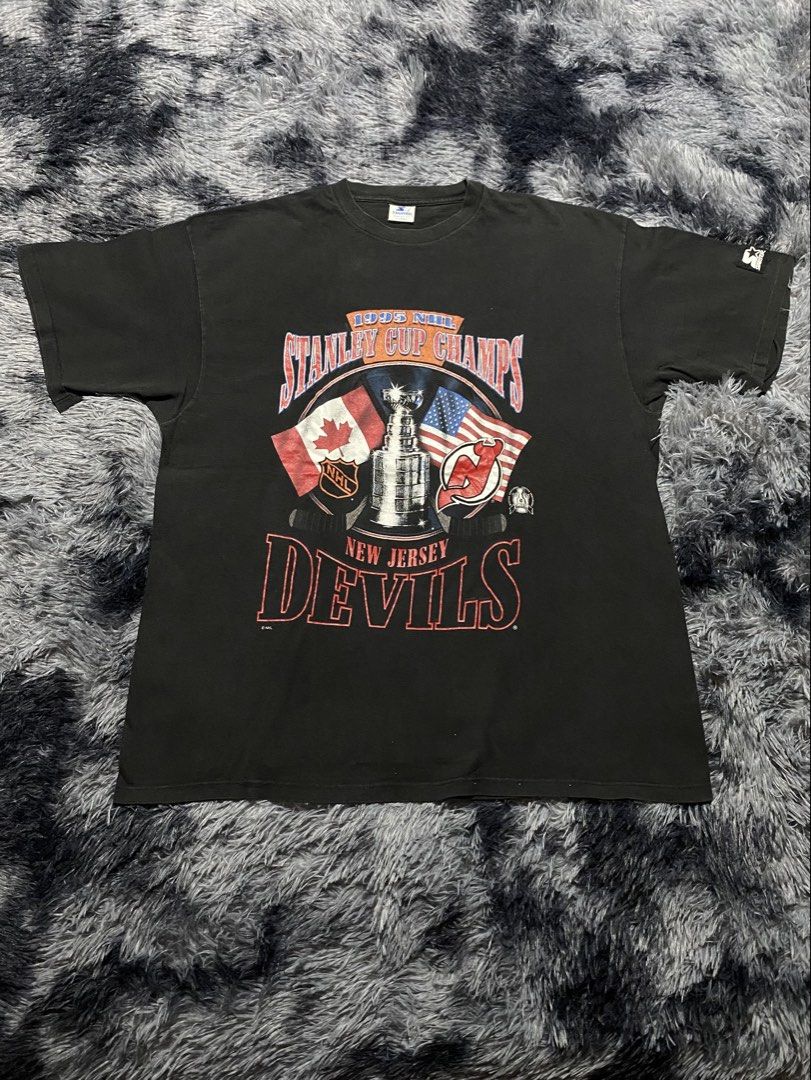 Vintage 1995 Starter New Jersey Devils Stanley Cup Champs tee (Category: Tshirts & Polo Shirts ) located in Manila. Submitted by zrothrift (Listing ID 1464629378, Image 1). Description: Vintage 1995 Starter New Jersey Devils Stanley Cup Champs tee Measurements: XL on Tag Width: 24 Inches Length: 30.5 Inches pen hole; crack prints; small white dot paint stains ₱880.