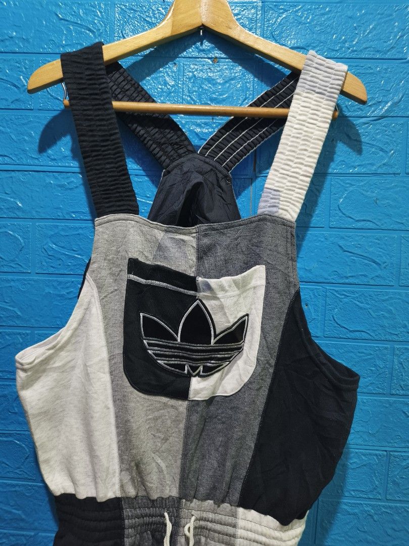 Vintage Adidas Patchwork Overalls Jumpsuit Size L (Category: Jumpsuits) located in Davao. Submitted by vndrgd (Listing ID 1464618158, Image 2). Description: - Cool Adidas patchwork overalls - Color block design: Grey, black, and white - Iconic trefoil logo on chest pocket and leg - Elasticated waistband with drawstring - Adjustable straps - Ideal for a casual, sporty look - Size: L.