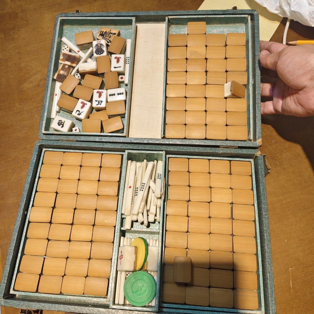 Vintage Bamboo Mahjong Set with Green Case (Category: Board Games & Puzzles) located in Bulacan. Submitted by babz30261 (Listing ID 1464692929, Image 2). Description: - Vintage complete mahjong set with authentic bamboo and bone tiles - Includes counting sticks, dice, and colorful gaming chips - Housed in a classic green textured carrying case with metal clasps - Beautiful natural patina showing lovely signs of age - Ready for family game nights 
