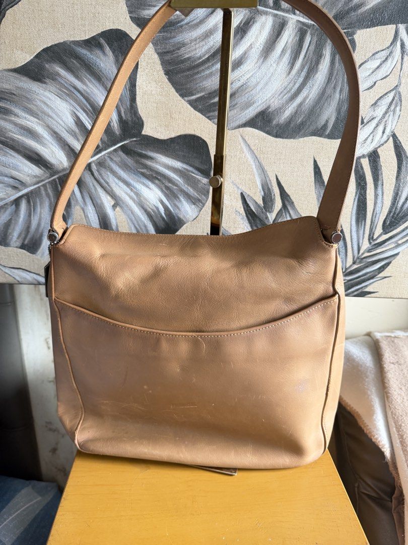 Vintage Coach Tan Leather Shoulder Bag (Category: Shoulder Bags) located in Quezon City. Submitted by good_finds_mnl (Listing ID 1464598883, Image 3). Description: Classic tan leather shoulder bag. Soft leather with a nice sheen. The strap is adjustable. Plenty of space inside for your essentials. A versatile bag for everyday use. Some minor scuffs on the leather from normal wear..