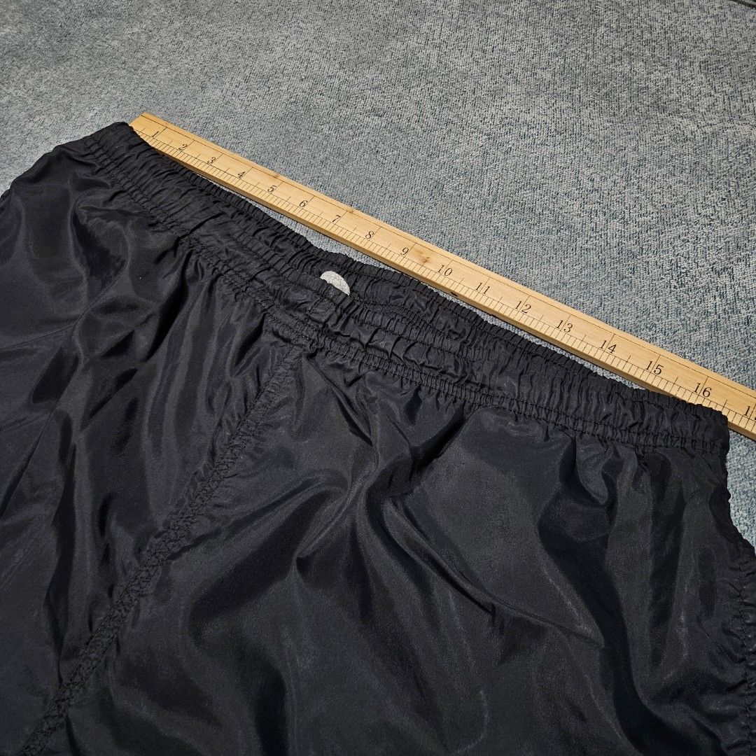Vintage nike black nylon track pants (Category: Joggers) located in Baguio. Submitted by fadexquisite (Listing ID 1464693362, Image 3). Description: Vintage nike black nylon track pants Size large on tag Waist 32-36inch Length 41inch Rise 14inch Inseam 29inch Leg opening 7inch Excellent condition 500 plus ship fee.