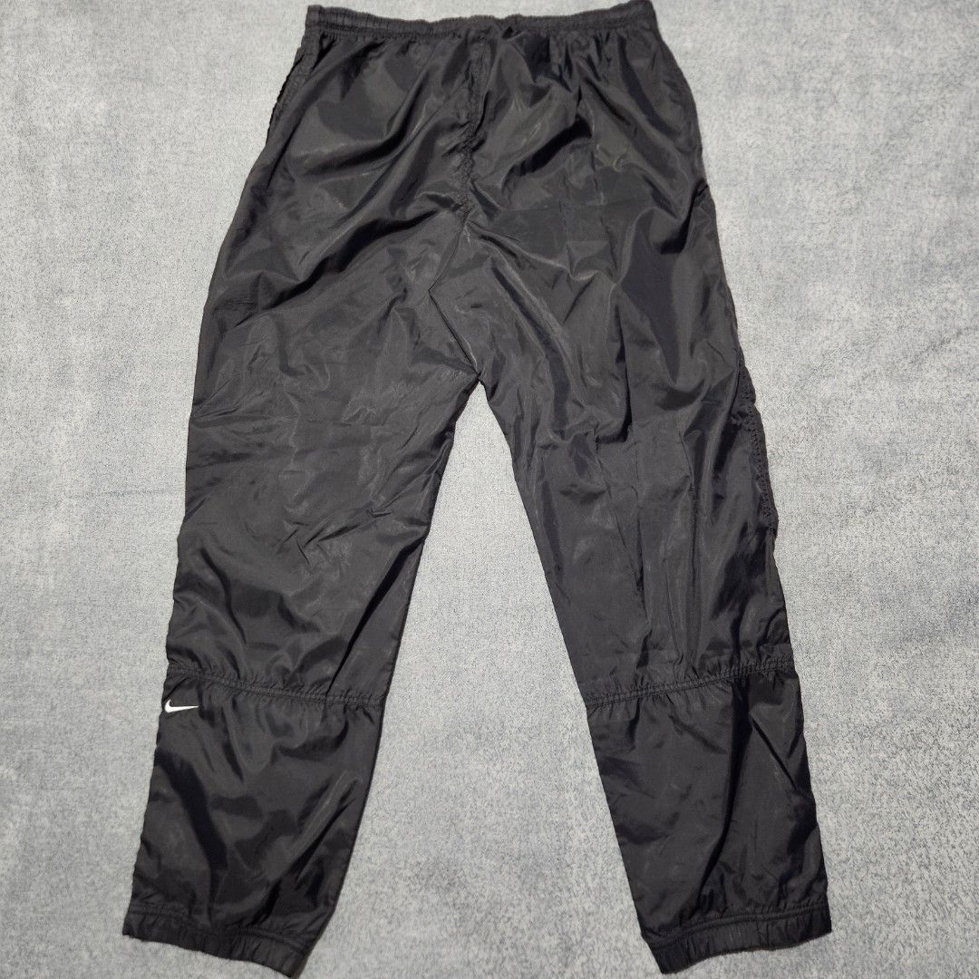 Vintage nike black nylon track pants (Category: Joggers) located in Baguio. Submitted by fadexquisite (Listing ID 1464693362, Image 1). Description: Vintage nike black nylon track pants Size large on tag Waist 32-36inch Length 41inch Rise 14inch Inseam 29inch Leg opening 7inch Excellent condition 500 plus ship fee.