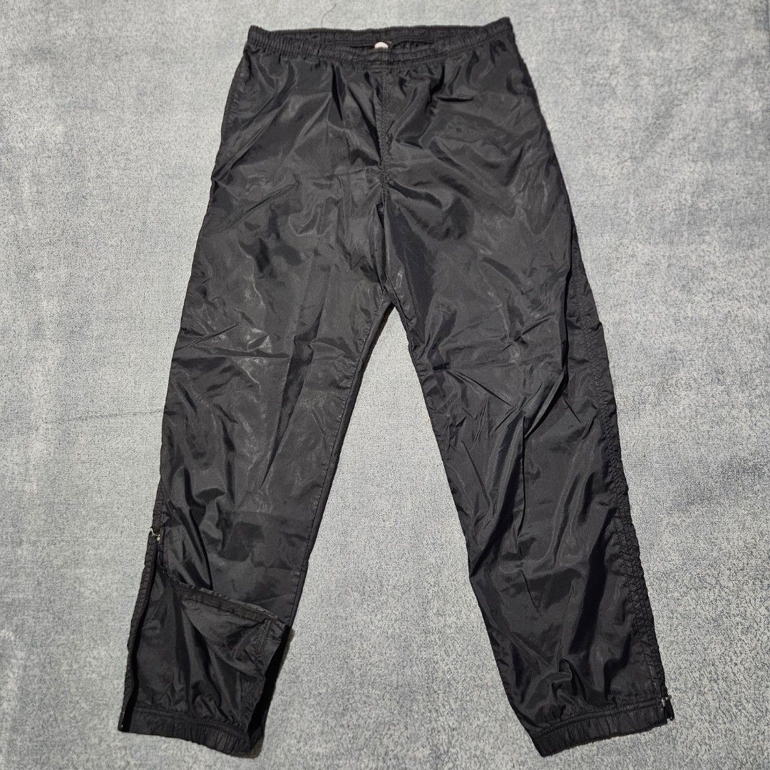 Vintage nike black nylon track pants (Category: Joggers) located in Baguio. Submitted by fadexquisite (Listing ID 1464693362, Image 2). Description: Vintage nike black nylon track pants Size large on tag Waist 32-36inch Length 41inch Rise 14inch Inseam 29inch Leg opening 7inch Excellent condition 500 plus ship fee.