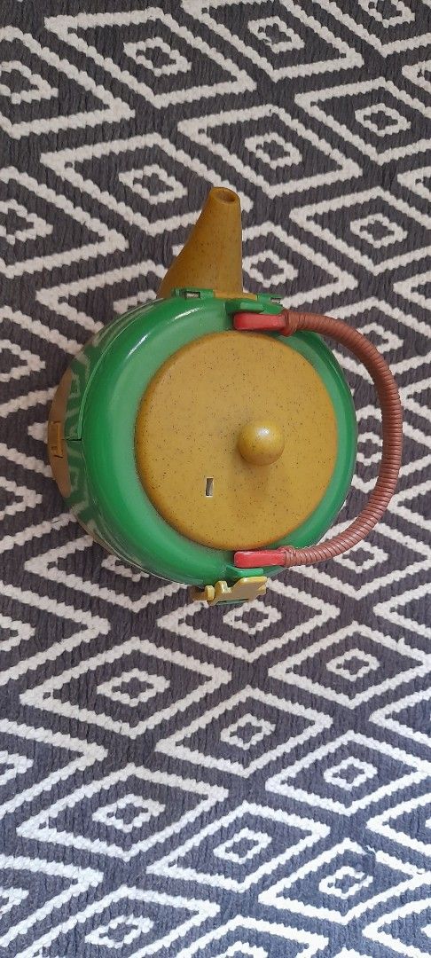 Vintage Polly Pocket Teapot Compact Playset (Category: Kids Toys) located in Bocaue. Submitted by marajapansurplus (Listing ID 1464580176, Image 3). Description: - Vintage Polly Pocket Teapot Compact Playset - Yellow and green teapot with brown handle - Opens to reveal a cute house interior - Ideal for imaginative play - Great for collectors and kids who enjoy small world play.