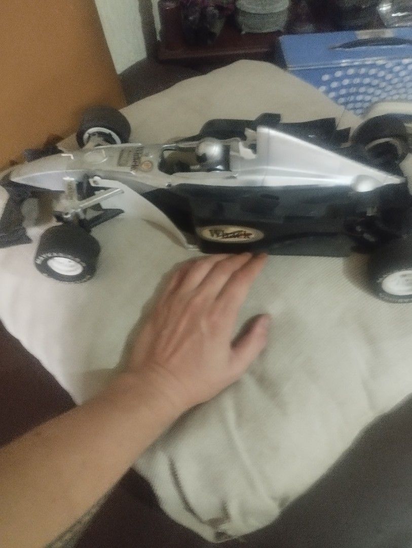 VINTAGE TOY CAR BIG SIZE (Category: Vehicle & Diecast Models) located in Mandaluyong City. Submitted by LEATHERFACE (Listing ID 1464580321, Image 3). Description: - Sleek, silver F1-style race car - Features black accents for a sporty look - Includes a driver figure inside - Ideal for both display and active play - Ready for its next owner!.