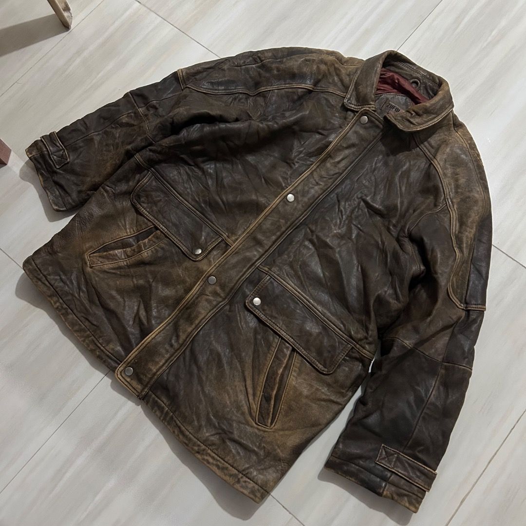 Vintage Zufulo Brown Leather Jacket (Category: Coats, Jackets and Outerwear) located in Sorsogon. Submitted by wayne.japon (Listing ID 1464661452, Image 2). Description: - Classic brown leather jacket with a distressed finish. - Two front pockets with button closures. - Button cuffs on sleeves. - Perfect for achieving a rugged aesthetic. Vintage Zufulo Japan Leather Jacket Good condition Leather 24x32 XL Issue on picture 350.