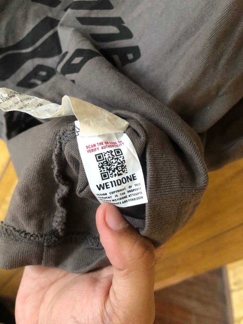 Welldone T-shirt Size M (Category: Tshirts & Polo Shirts ) located in Romblon. Submitted by teppthrift. (Listing ID 1464627072, Image 3). Description: - Authentic Wetdone Grey T-Shirt - Size: Medium (M) 24x27 - Material: 100% Cotton - Design: Multiple 'Wetdone' logos printed on the front - Authenticity: Verified via QR code on tag - Ideal for: Casual wear.