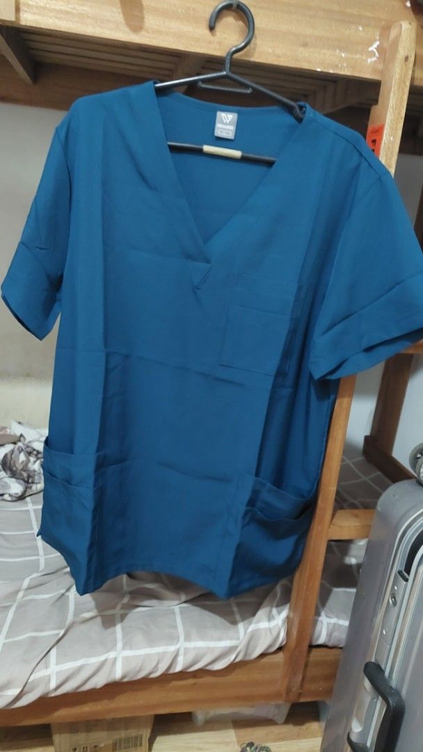 WENURSE Scrub Suit Carribean Blue - Large (Category: Sets or Coordinates) located in Mandaue City. Submitted by nikkis.knickknacks (Listing ID 1464645074, Image 2). Description: WENURSE Caribbean Blue Scrubs • Size: Large (L) • Condition: Brand New • RFS: wrong size purchased • Fabric: 94% Polyester, 6% Spandex •Feels vv similar to OTG, but larger sizing • color exactly like product photo • Top: V-neck, multiple pockets • Pants: Drawstring waist 