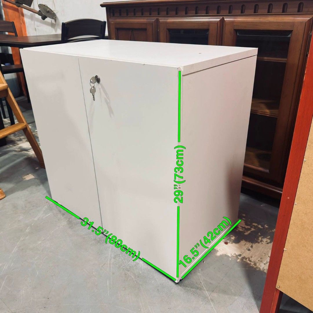White 2-Door Side Storage Cabinet with Lock (Category: Shelves, Cabinets & Racks) located in Quezon City. Submitted by dannikkishoppe2 (Listing ID 1464706062, Image 2). Description: White 2-Door Side Storage Cabinet with Lock ‼️₱3500‼️ • Color/Finish: Clean solid white • Storage: Two doors with adjustable shelves • Security: Includes working lock and keys • Dimensions: 31.5" (W) x 16.5" (D) x 29" (H) • Condition: Sturdy build, ready to use • Vers