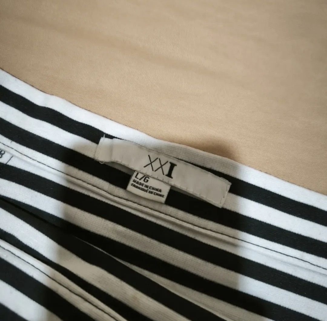 White and black striped skirt (Category: Skirts) located in Manila. Submitted by wearforce (Listing ID 1464594321, Image 3). Description: White and black striped skirt can fit M-L good condition no issues color rate 9/10 150 + sf.