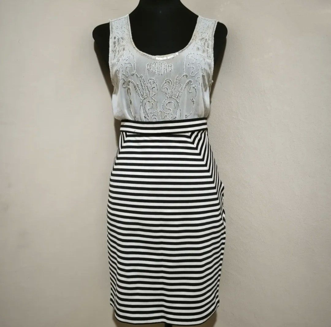White and black striped skirt (Category: Skirts) located in Manila. Submitted by wearforce (Listing ID 1464594321, Image 1). Description: White and black striped skirt can fit M-L good condition no issues color rate 9/10 150 + sf.