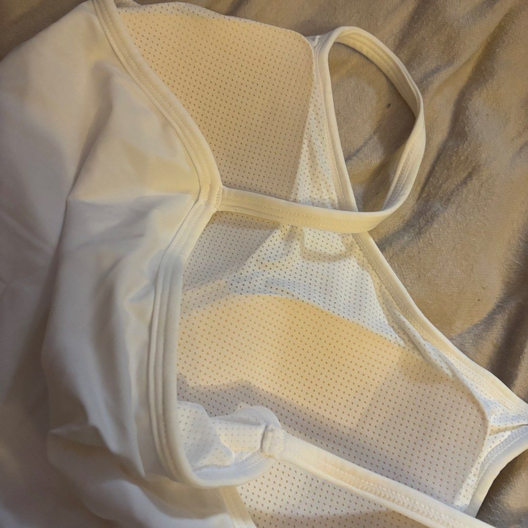 White Built-in Bra Tank Top (Category: Sleeveless) located in Cainta. Submitted by kairus.luckyfind (Listing ID 1464644296, Image 2). Description: FITS S-M similar to uniqlo quality - White tank top with integrated bra cups - Soft and comfortable material for daily wear - Features adjustable straps for a perfect fit - Mesh panel at the back enhances breathability - Versatile for layering or wearing as a standalone top.