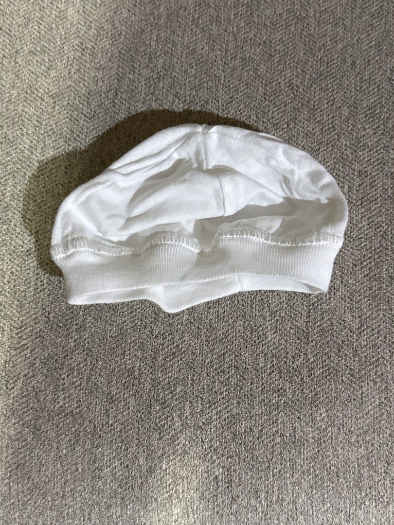 White Cotton Newborn Hat (Category: Hats & Beanies) located in Cebu City. Submitted by jillianmariebascones (Listing ID 1464691776, Image 1). Description: - Classic white newborn hat - Made from soft cotton material - Features an elasticated band for a comfortable fit - Versatile for everyday styling - Easy to pair with various outfits.