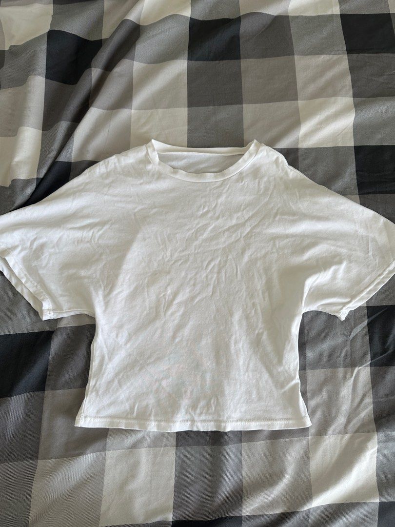 White Cropped T-Shirt (Category: Shirts) located in Paranaque City. Submitted by declutterwyae (Listing ID 1464607171, Image 2). Description: - Basic white cropped t-shirt - Short sleeves - Crew neck - Versatile and easy to style - Great for layering or wearing on its own - Perfect for casual outfits.