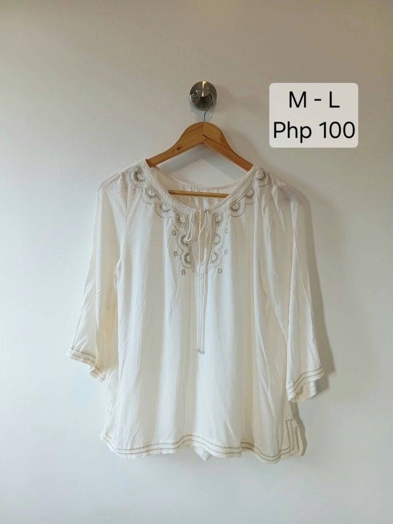 White Embroidered Blouse with Tie Neck (Category: Blouses) located in Manila. Submitted by wisecat.4a7eea (Listing ID 1464602445, Image 1). Description: - White 3/4 sleeve blouse - Delicate embroidery around neckline and cuffs - Front tie detail - Lightweight fabric for comfort - Versatile for casual or dressed-up looks.