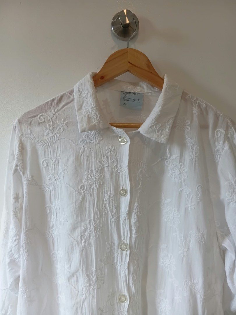 White Embroidered Button-Up Blouse S-M (Category: Blouses) located in Manila. Submitted by wisecat.4a7eea (Listing ID 1464634312, Image 3). Description: - White long-sleeved blouse - All-over intricate floral embroidery - Collared neckline - Button-up front - Unique scalloped hem with floral appliques and bead details - Versatile for casual or semi-formal wear - Size: S-M.