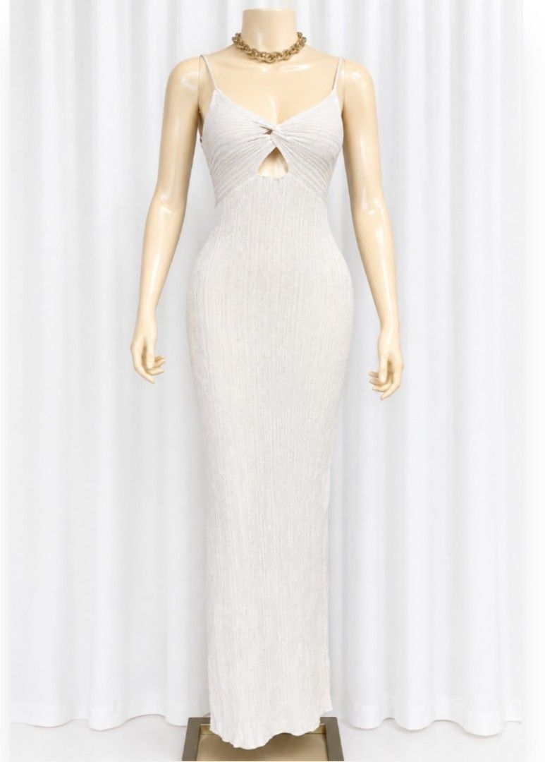 White Knit Maxi Dress Cutout Front (Category: Dresses) located in Pateros City. Submitted by myshahnmia (Listing ID 1464748707, Image 1). Description: - Color: Off- White - Material: Ribbed knit - Style: Spaghetti straps, twist-knot front, small bust cutout, floor-length maxi, side slit - Fit: Slim bodycon - Condition: Excellent, clean with no stains or damage PM for "when worn" photo.