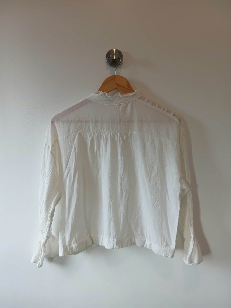 White Lace Detail Button-Up Blouse S-L Php 100 (Category: Blouses) located in Manila. Submitted by wisecat.4a7eea (Listing ID 1464601927, Image 2). Description: - Chic white long-sleeved blouse - Features intricate lace detailing on the front and collar - Classic button-up front closure - Trendy bell sleeves with elegant ruffled cuffs - Lightweight and comfortable fabric - Versatile for both casual and dressy outfits - Fits sizes Small to Large (