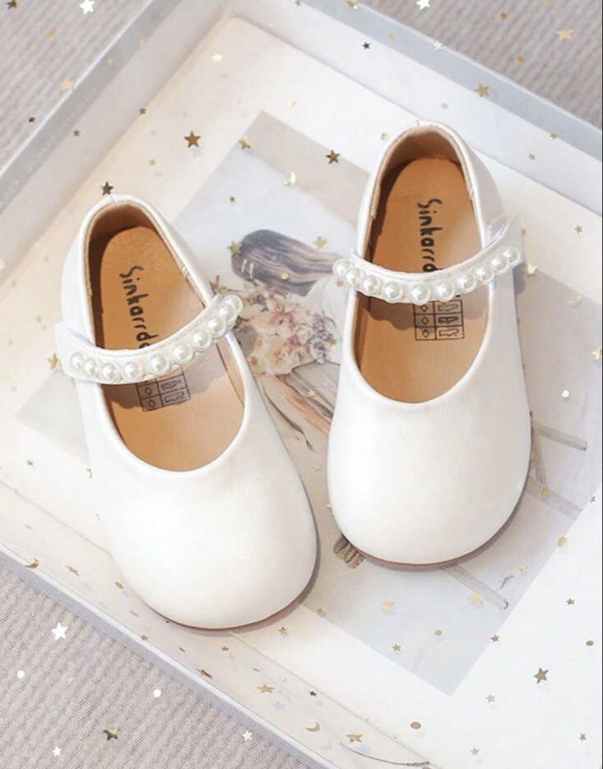White Mary Jane Shoes with Pearl Strap (Category: Babies & Kids Fashion) located in Quezon City. Submitted by haylow (Listing ID 1464652945, Image 1). Description: Size- euro 31 (13.5 cm) - Adorable white Mary Jane shoes for kids. - Features a pretty pearl strap across the top. - Easy to put on and take off. - Ideal for parties and special occasions. - Designed for comfort for little feet..