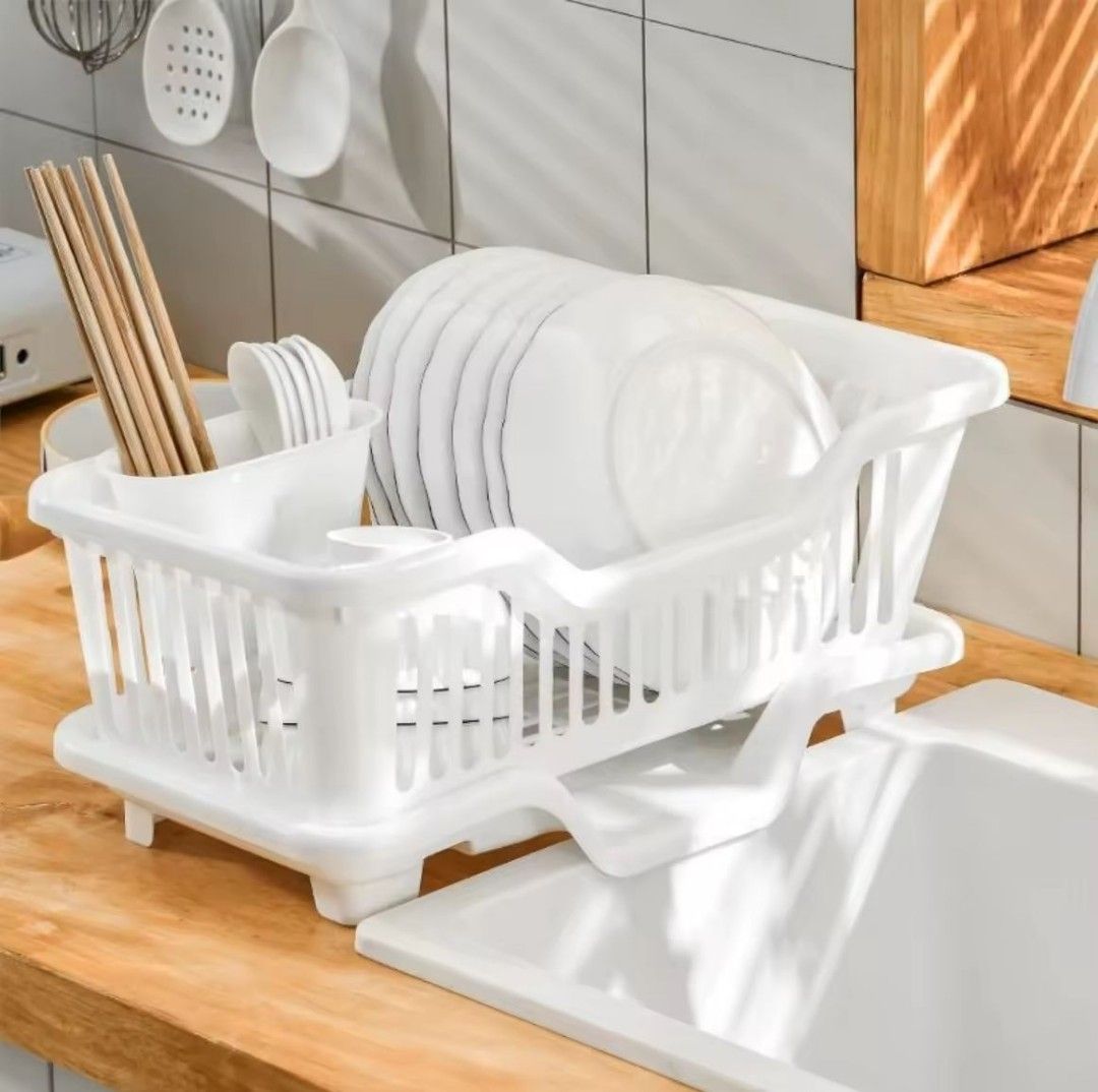 White Plastic Dish Drying Rack with Drain Tray (Category: Bathroom & Kitchen Fixtures) located in Manila. Submitted by pauwie40838 (Listing ID 1464688329, Image 1). Description: - Color: White - Material: Durable plastic - Design: Compact 2-tier structure for plates, bowls, and cutlery - Features: Built-in utensil holder and matching bottom drip tray - Benefit: Keeps kitchen counters clean, dry, and organized - Condition: Brand new - Shipping or 