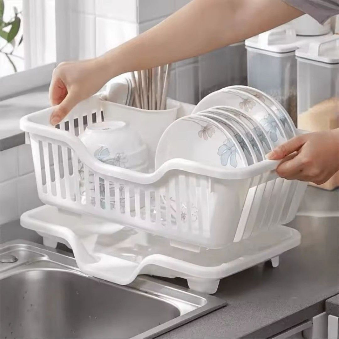 White Plastic Dish Drying Rack with Drain Tray (Category: Bathroom & Kitchen Fixtures) located in Manila. Submitted by pauwie40838 (Listing ID 1464688329, Image 2). Description: - Color: White - Material: Durable plastic - Design: Compact 2-tier structure for plates, bowls, and cutlery - Features: Built-in utensil holder and matching bottom drip tray - Benefit: Keeps kitchen counters clean, dry, and organized - Condition: Brand new - Shipping or 