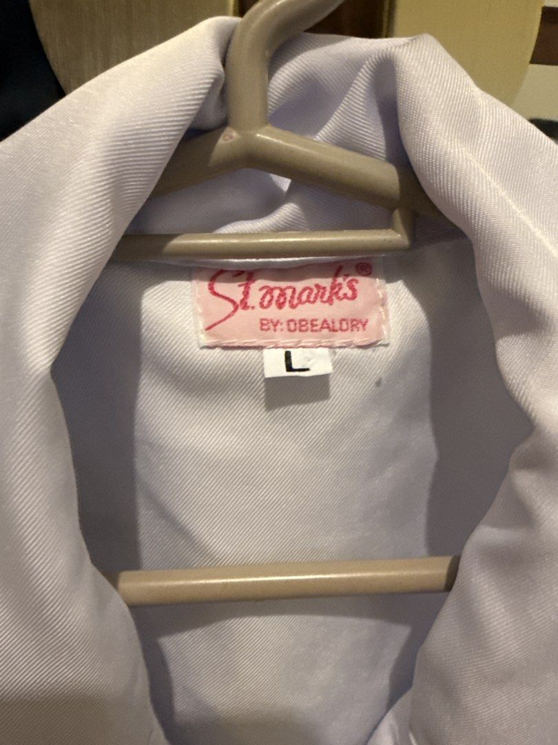 White polo/nursing blouse TOP ONLY (Category: Blouses) located in Quezon City. Submitted by joroguhi (Listing ID 1464735846, Image 2). Description: Large on tag With one button replaced with a different color ng button (wala po akong clear 😅) Clean and ready to use. NALABHAN NA PO. Planchahin niyo nalang po 📍qc, near vertis north.