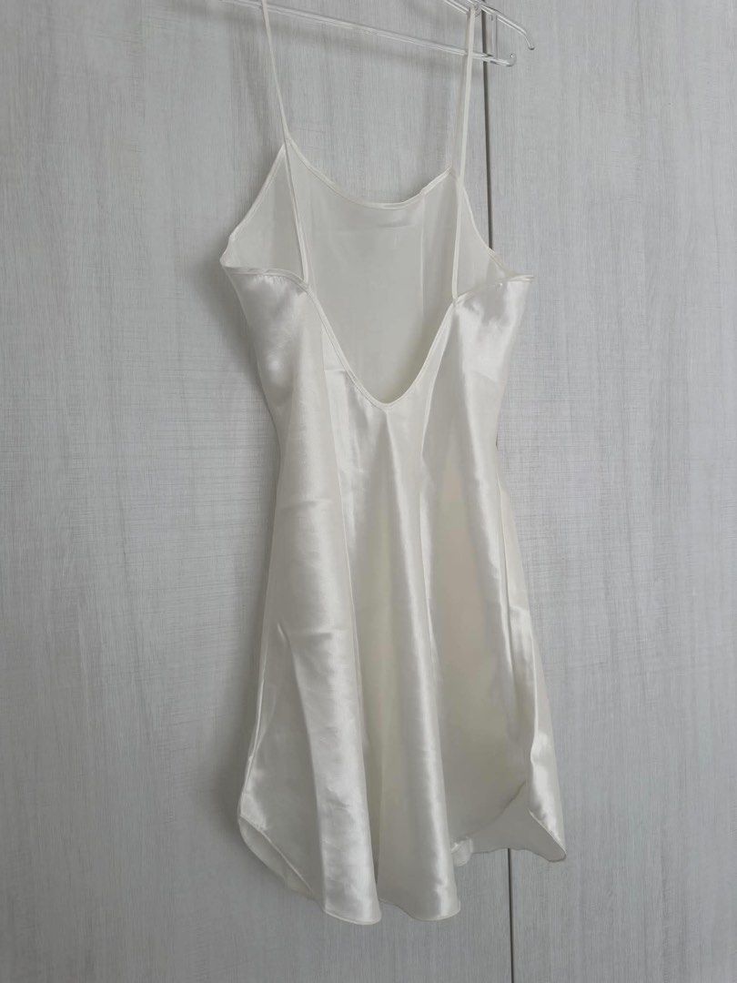 White Satin Slip Nightgown (Category: Undergarments & Loungewear) located in Cainta. Submitted by kairus.luckyfind (Listing ID 1464625749, Image 2). Description: FITS S-M - Elegant white satin slip nightgown - Thin spaghetti straps - Flattering V-neckline in front - Chic low scoop back - Silky smooth and comfortable material - Perfect for sleeping or lounging - Estimated size: Small to Medium.