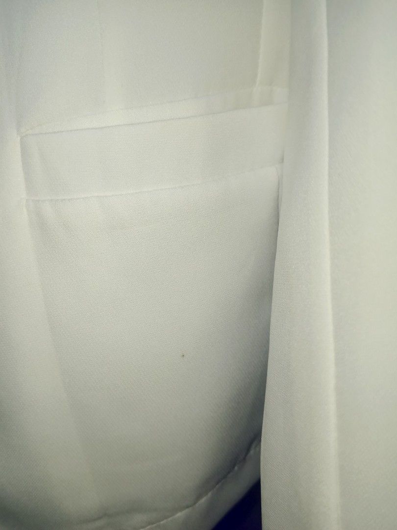 White Single Button Blazer (Category: Coats, Jackets and Outerwear) located in Manila. Submitted by mauve_777 (Listing ID 1464623407, Image 3). Description: - Classic white blazer - Single button closure - Two side flap pockets - Smooth material with a slight sheen - Versatile for work or night out - Small mark on front pocket area.