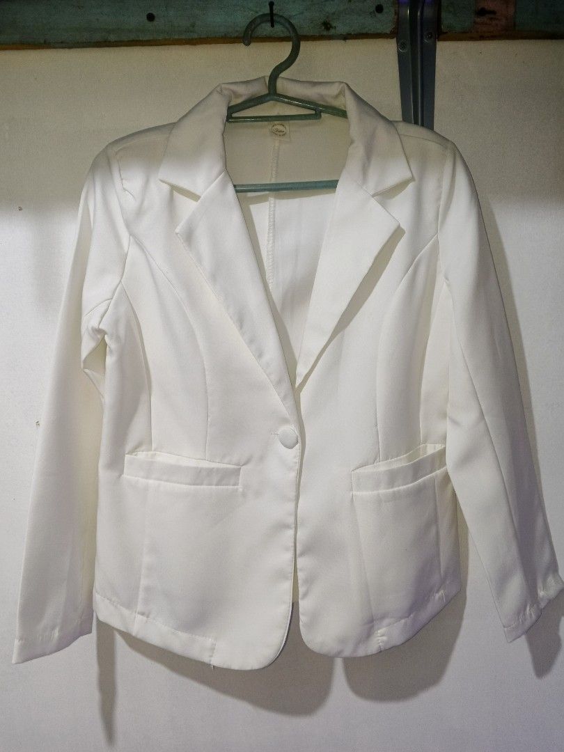 White Single Button Blazer (Category: Coats, Jackets and Outerwear) located in Manila. Submitted by mauve_777 (Listing ID 1464623407, Image 1). Description: - Classic white blazer - Single button closure - Two side flap pockets - Smooth material with a slight sheen - Versatile for work or night out - Small mark on front pocket area.