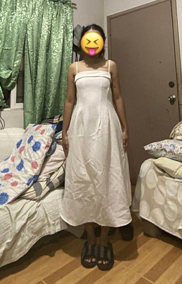 White Spaghetti Strap Midi Dress (Category: Dresses) located in Manila. Submitted by neachellbi45044 (Listing ID 1464689096, Image 2). Description: - Color: White - Length: Midi with flare skirt - Neckline: Straight neckline with thin straps - Design: Structured bodice paneling and back zipper with upper back V-cut - Condition: Worn a few times, cleaned, and ready to wear - With slight alterations but can be removed.
