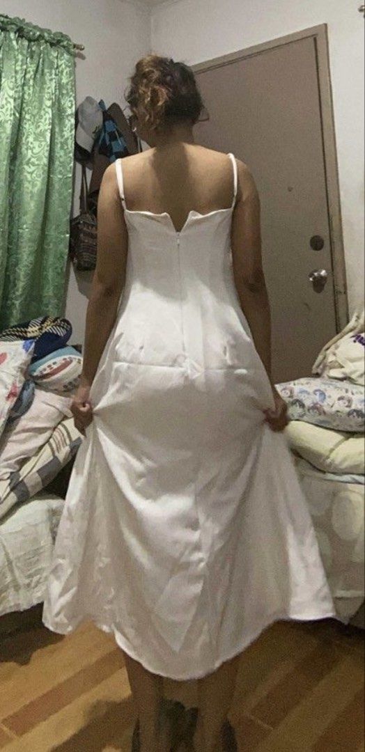 White Spaghetti Strap Midi Dress (Category: Dresses) located in Manila. Submitted by neachellbi45044 (Listing ID 1464689096, Image 3). Description: - Color: White - Length: Midi with flare skirt - Neckline: Straight neckline with thin straps - Design: Structured bodice paneling and back zipper with upper back V-cut - Condition: Worn a few times, cleaned, and ready to wear - With slight alterations but can be removed.