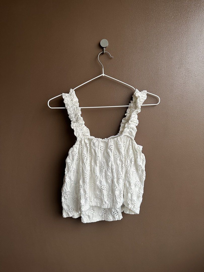 White textured ruffled strap tank top (Category: Sleeveless) located in Pasig City. Submitted by afterglowpreloved (Listing ID 1464723240, Image 2). Description: .