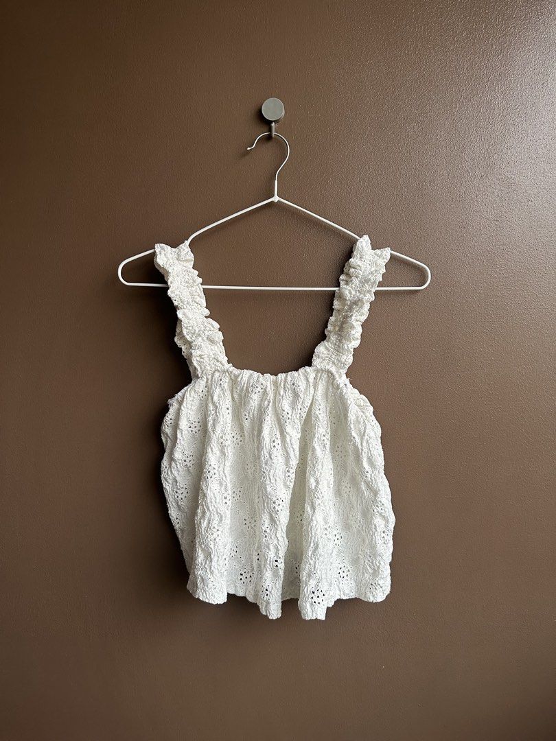 White textured ruffled strap tank top (Category: Sleeveless) located in Pasig City. Submitted by afterglowpreloved (Listing ID 1464723240, Image 1). Description: .
