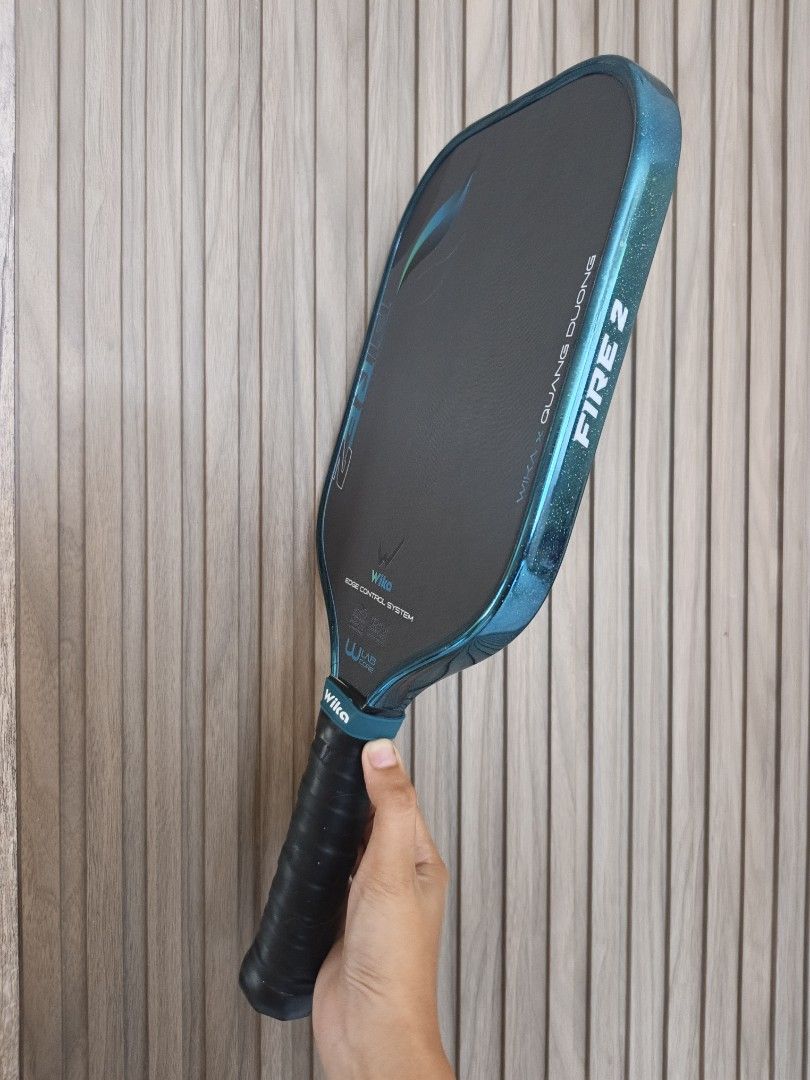 Wika Fire 2 Pickleball Paddle (Category: Racket and Ball Sports) located in Nabunturan. Submitted by Xenonshop (Listing ID 1464586587, Image 2). Description: - Wika QD Fire 2 pickleball paddle - Collaboration with Quang Duong - Features Edge Control System for enhanced stability - Utilizes W-Lab technology for superior performance - Designed for excellent control and balance - Perfect for your next pickleball match -Used only for days since Septe