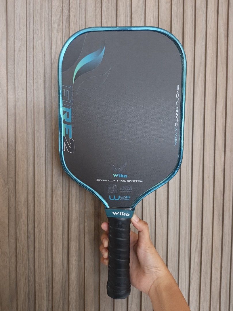 Wika Fire 2 Pickleball Paddle (Category: Racket and Ball Sports) located in Nabunturan. Submitted by Xenonshop (Listing ID 1464586587, Image 1). Description: - Wika QD Fire 2 pickleball paddle - Collaboration with Quang Duong - Features Edge Control System for enhanced stability - Utilizes W-Lab technology for superior performance - Designed for excellent control and balance - Perfect for your next pickleball match -Used only for days since Septe