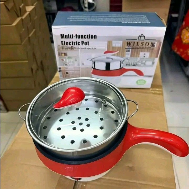 Wilson Multi-Function Electric Pot with Steamer Red (Category: Cookers) located in Manila. Submitted by berdenmarl01688 (Listing ID 1464748110, Image 1). Description: - Brand/Model: Wilson Multi-Function Electric Pot - Color: Bright Red (comes with original box) - Perfect for: Quick meals, boiling, frying, and steaming in small spaces - Inclusions: Clear glass lid, stainless steel steamer insert, and power cord - Features: Simple plug-in operatio