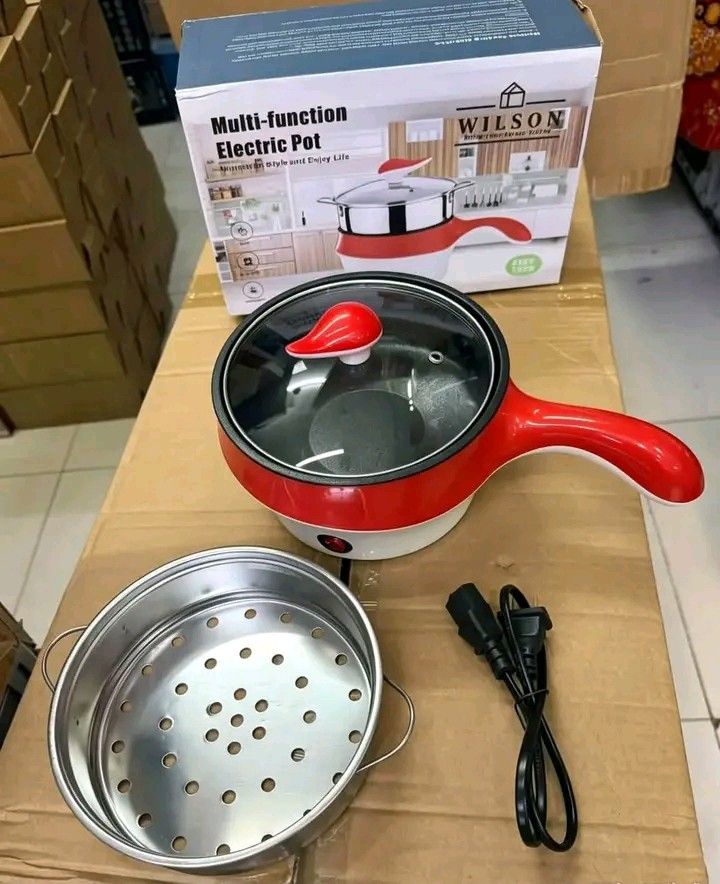 Wilson Multi-Function Electric Pot with Steamer Red (Category: Cookers) located in Manila. Submitted by berdenmarl01688 (Listing ID 1464748110, Image 2). Description: - Brand/Model: Wilson Multi-Function Electric Pot - Color: Bright Red (comes with original box) - Perfect for: Quick meals, boiling, frying, and steaming in small spaces - Inclusions: Clear glass lid, stainless steel steamer insert, and power cord - Features: Simple plug-in operatio