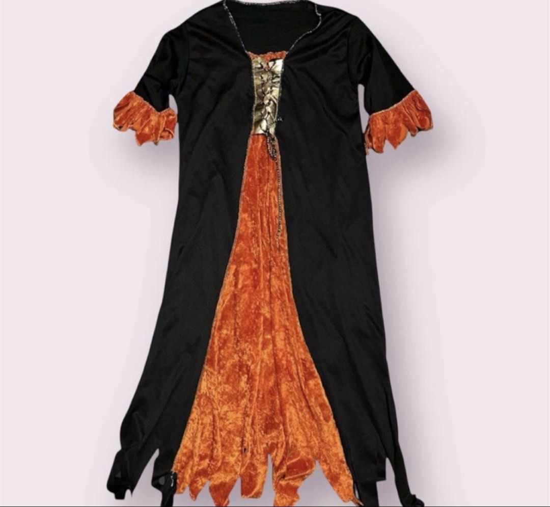 Witch Halloween Costume 8-10yo (Category: Babies & Kids Fashion) located in Rizal. Submitted by cassappl (Listing ID 1464730903, Image 1). Description: - Edgy black long-sleeve dress, perfect for Halloween and costume parties - Vibrant orange velvet center panels and matching ruffled cuffs - Gold lace-up chest detail accented with hanging chains - Trendy jagged hemline for a unique look - Convenient pullover style that is easy to slip on.
