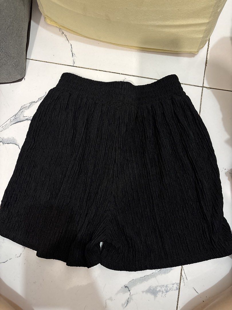 Women's black gartered shorts (Category: Shorts) located in Quezon City. Submitted by den.declutters (Listing ID 1464636497, Image 1). Description: Freesize but fits 24-26 waist line.