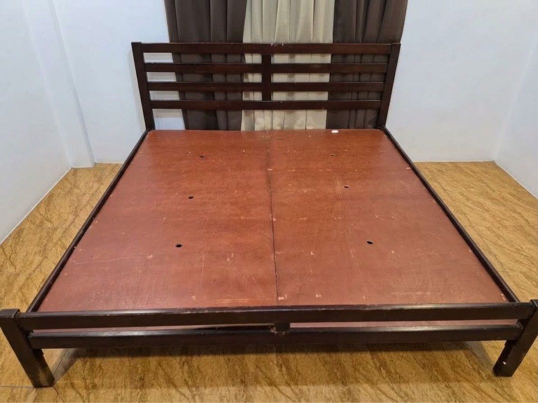 Wooden Bed Frame with Headboard (Category: Bed Frames & Mattresses) located in Subic. Submitted by mjoyced (Listing ID 1464575575, Image 2). Description: - Dark wood bed frame - king size - Slatted headboard - Sturdy construction - Selling due to bedroom upgrade - bedding not included - Pick up only.