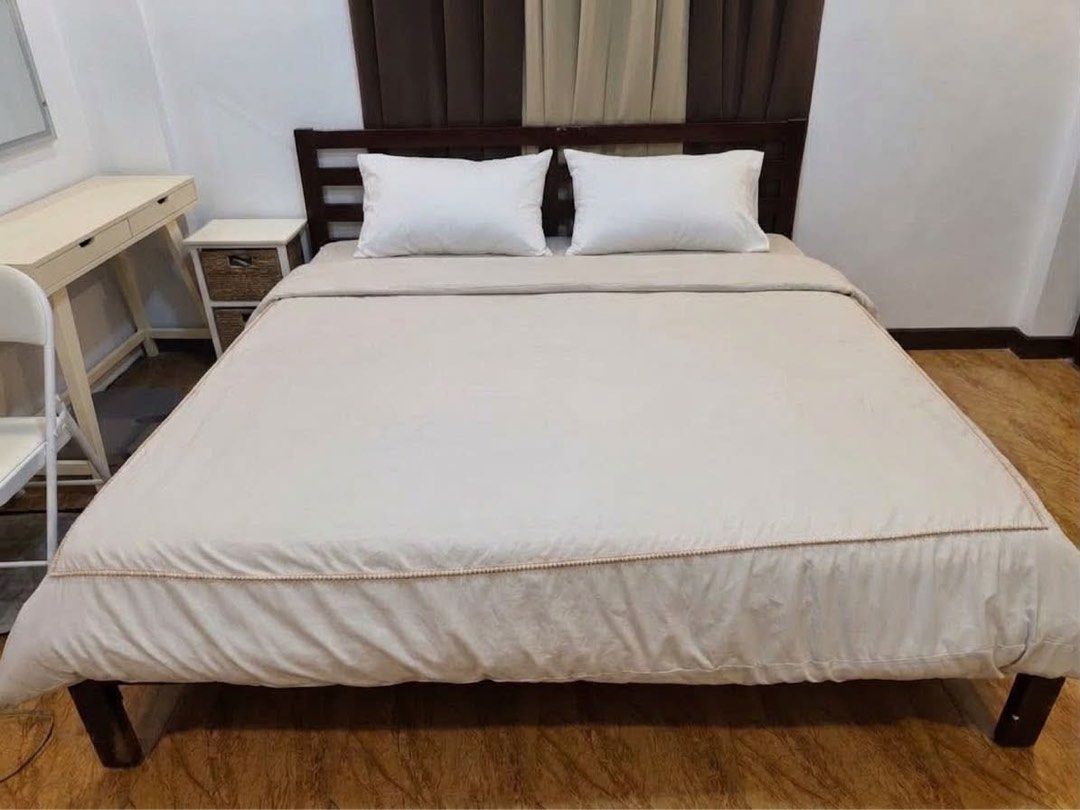 Wooden Bed Frame with Headboard (Category: Bed Frames & Mattresses) located in Subic. Submitted by mjoyced (Listing ID 1464575575, Image 1). Description: - Dark wood bed frame - king size - Slatted headboard - Sturdy construction - Selling due to bedroom upgrade - bedding not included - Pick up only.