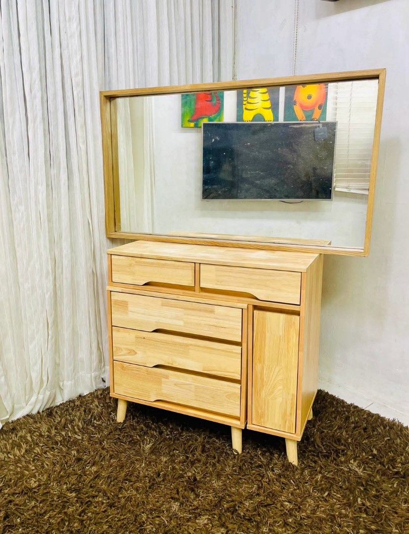 Wooden Dressing Table with Mirror and Storage (Category: Tables & Sets) located in Antipolo. Submitted by roselle001 (Listing ID 1464646642, Image 1). Description: - Solid wood construction for durability - Large, clear mirror for your reflection - Ample storage with multiple drawers and a cabinet - Beautiful, natural wood grain - Sturdy legs for stability - Perfect for organizing makeup and accessories.