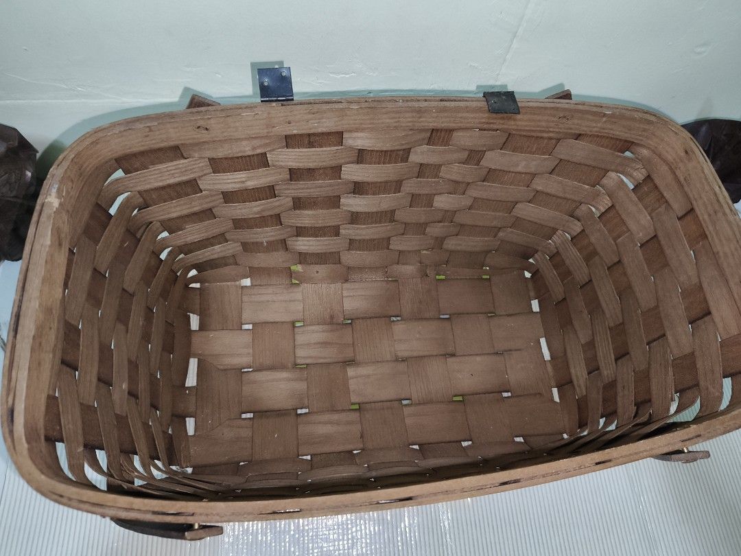 Wooden Woven Storage Basket with Handle (Category: Storage Boxes & Baskets) located in Manila. Submitted by reascheyss51406 (Listing ID 1464707704, Image 3). Description: - Size: Medium with a practical rectangular base and flat bottom - Material: Natural wood finish with a classic woven splint pattern - Features: Sturdy side handles for easy carrying and small metal hinges along the back rim - Versatile Use: Great for organizing shelves, gatheri