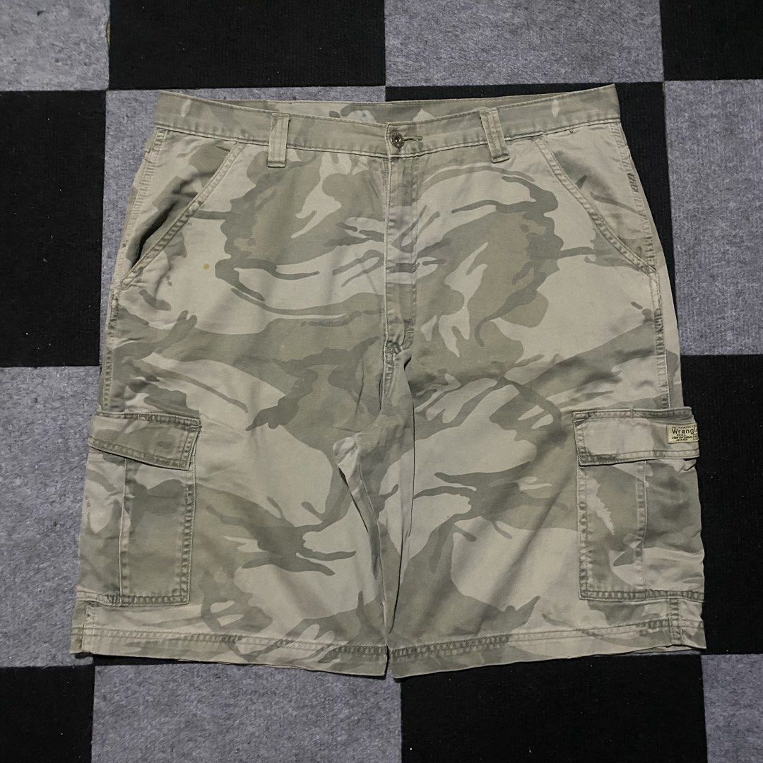 Wrangler Camouflage Cargo Shorts (Category: Shorts) located in Manila. Submitted by gregmarc5503863 (Listing ID 1464752267, Image 1). Description: - Brand: Wrangler - Design: Camouflage in green and tan tones - Material: Durable, high-quality cotton fabric - Pockets: Multiple utility pockets including button-flap cargo and back pockets - Closure: Branded metal button waist closure - Features: Standard belt loops - Style: Casual, great for outdoor
