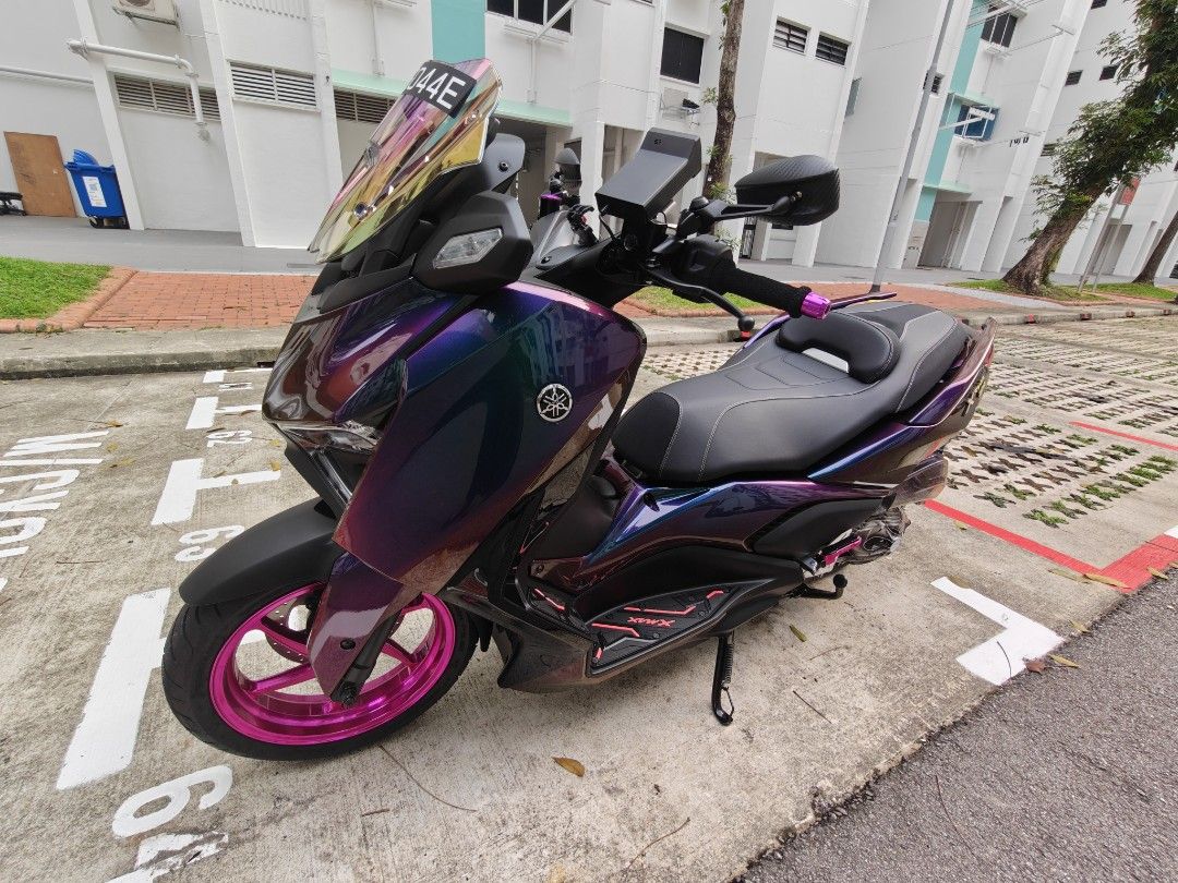 XMAX VERSION 3 (Category: Motorcycle Accessories) located in Singapore. Submitted by bintegarep84 (Listing ID 1464580470, Image 2). Description: I spray this colour 3 days ago and didn't like it. it's a 4 tone colours, which consist of Purple,Blue,gold and green. I'm selling at a loss. no nego. it's more to men colour I guess. 😅😅.