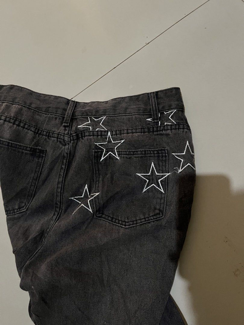 Y2K Star Embroidered Distressed Denim Pants (Category: Jeans) located in Baguio. Submitted by nifty.grails (Listing ID 1464571805, Image 3). Description: W: 31 L: 42 Acid/Washed Black Denim Embroidered star patterns Minor Distressing Texture Zippered Side Hems.
