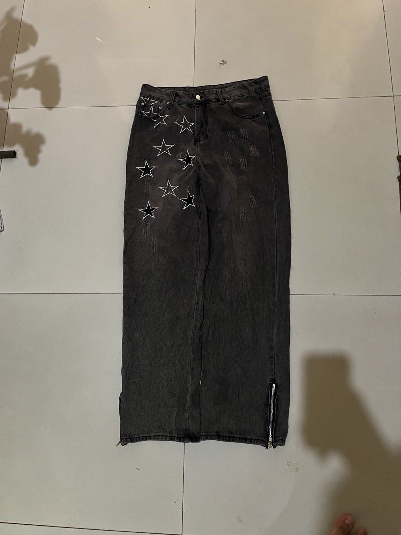 Y2K Star Embroidered Distressed Denim Pants (Category: Jeans) located in Baguio. Submitted by nifty.grails (Listing ID 1464571805, Image 1). Description: W: 31 L: 42 Acid/Washed Black Denim Embroidered star patterns Minor Distressing Texture Zippered Side Hems.