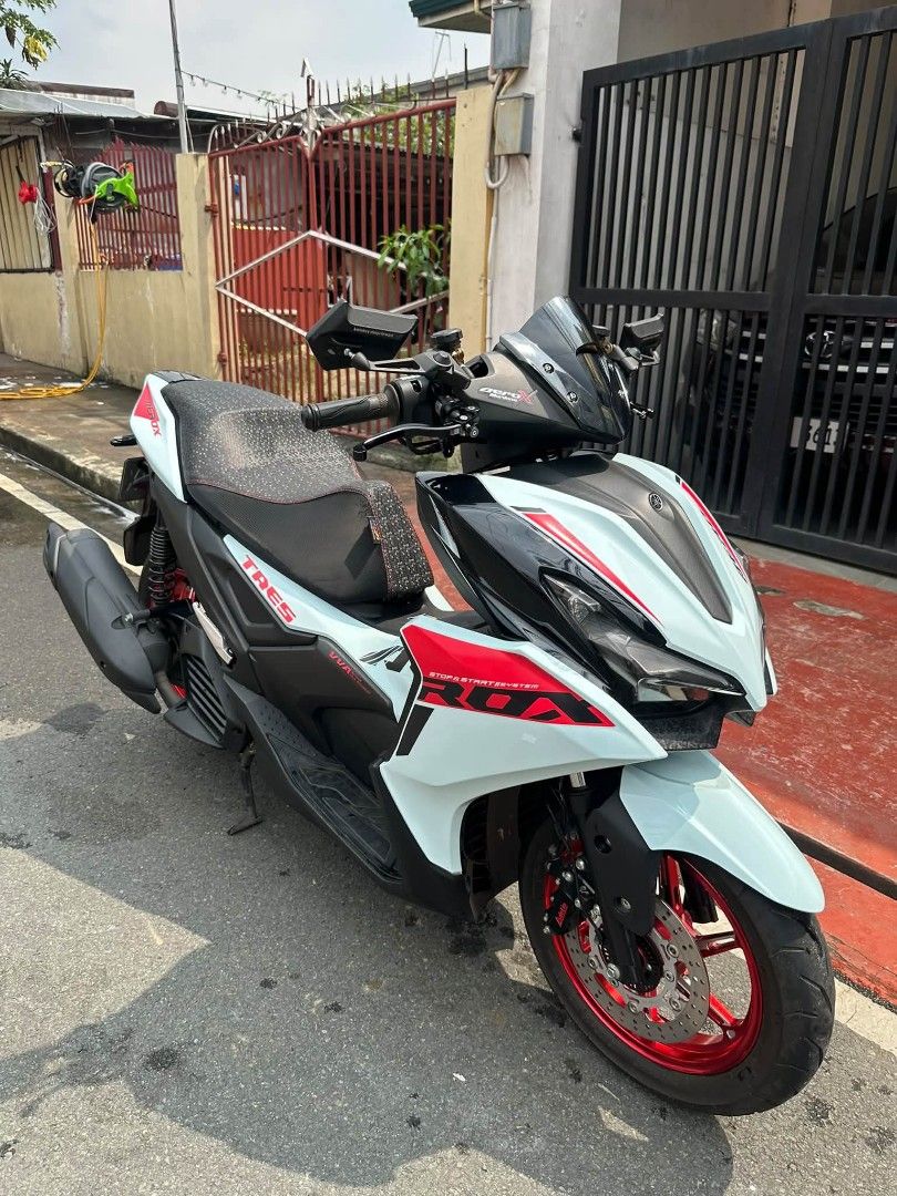 Yamaha Aerox 155 VVA Matte White Red (Category: Motorbikes for Sale) located in Marikina City. Submitted by traviz_ (Listing ID 1464596861, Image 1). Description: Yamaha Aerox 155 VVA in matte white with red accents. Sporty design. Has a custom seat cover. Ready for the road. Low mileage. Well maintained. Great for city rides and longer trips..