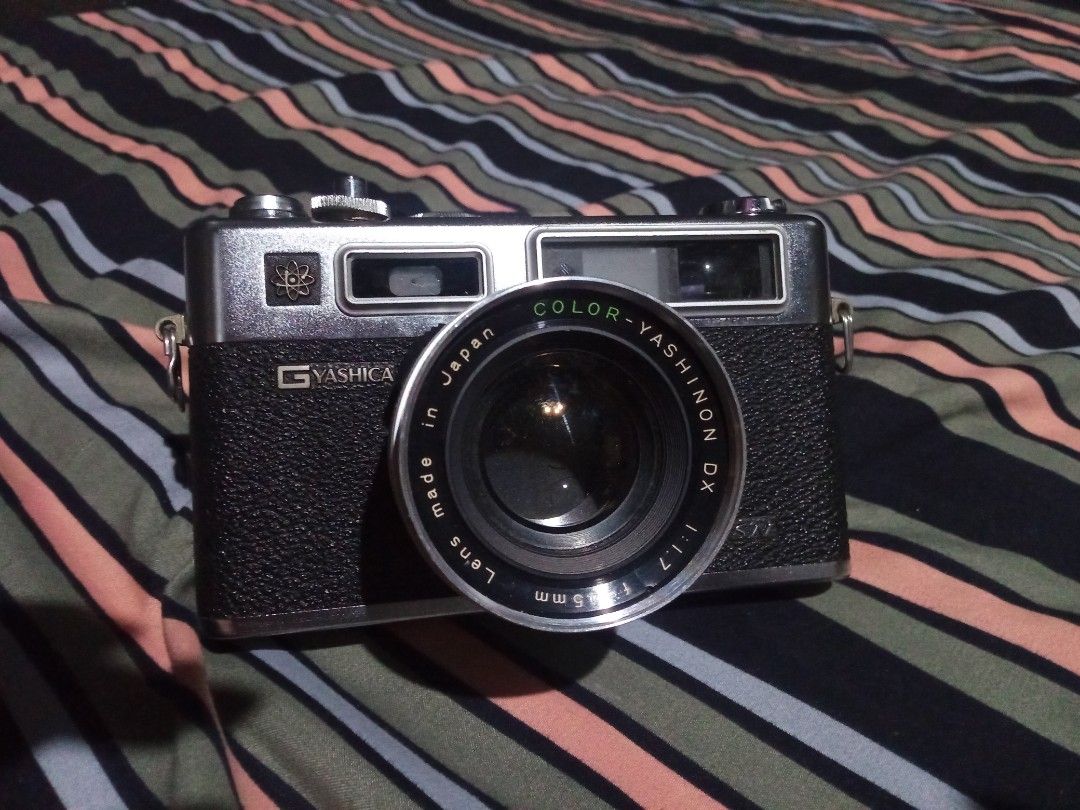 Yashica Electro 35 GSN (send offers) (Category: Cameras) located in Minglanilla. Submitted by keith_digicams (Listing ID 1464708390, Image 1). Description: - Camera: Yashica Electro 35 vintage analog rangefinder - Lens: Color-Yashinon DX 45mm f/1.7 - Shutter: Copal leaf shutter - Features: Battery check button with red indicator light, top plate ASA film speed dial, and hot shoe - Condition: Clean film chamber with intact pressure plate - Build: 